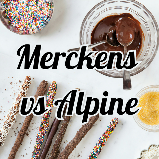 Melted Chocolate in a glass bowl with two bowls of sprinkles. Chocolate covered pretzel rods are scattered across the bottom of the image. Large bold stating Merckens VS Alpine